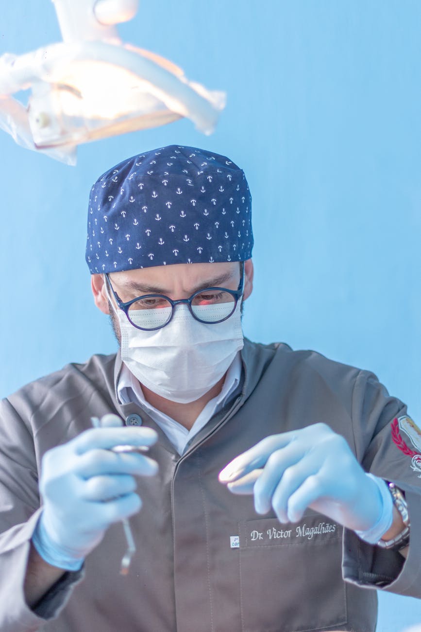 man wearing gray collared top